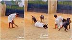“Doberman Rottweiler”: Nigerian Lady Pranks Her Dogs & Falls, They Rush to Rescue Her in Lovely Video